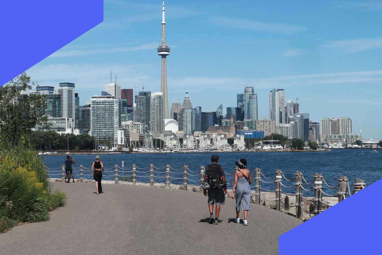 A photo of the Toronto waterfront admist a dark sky.
