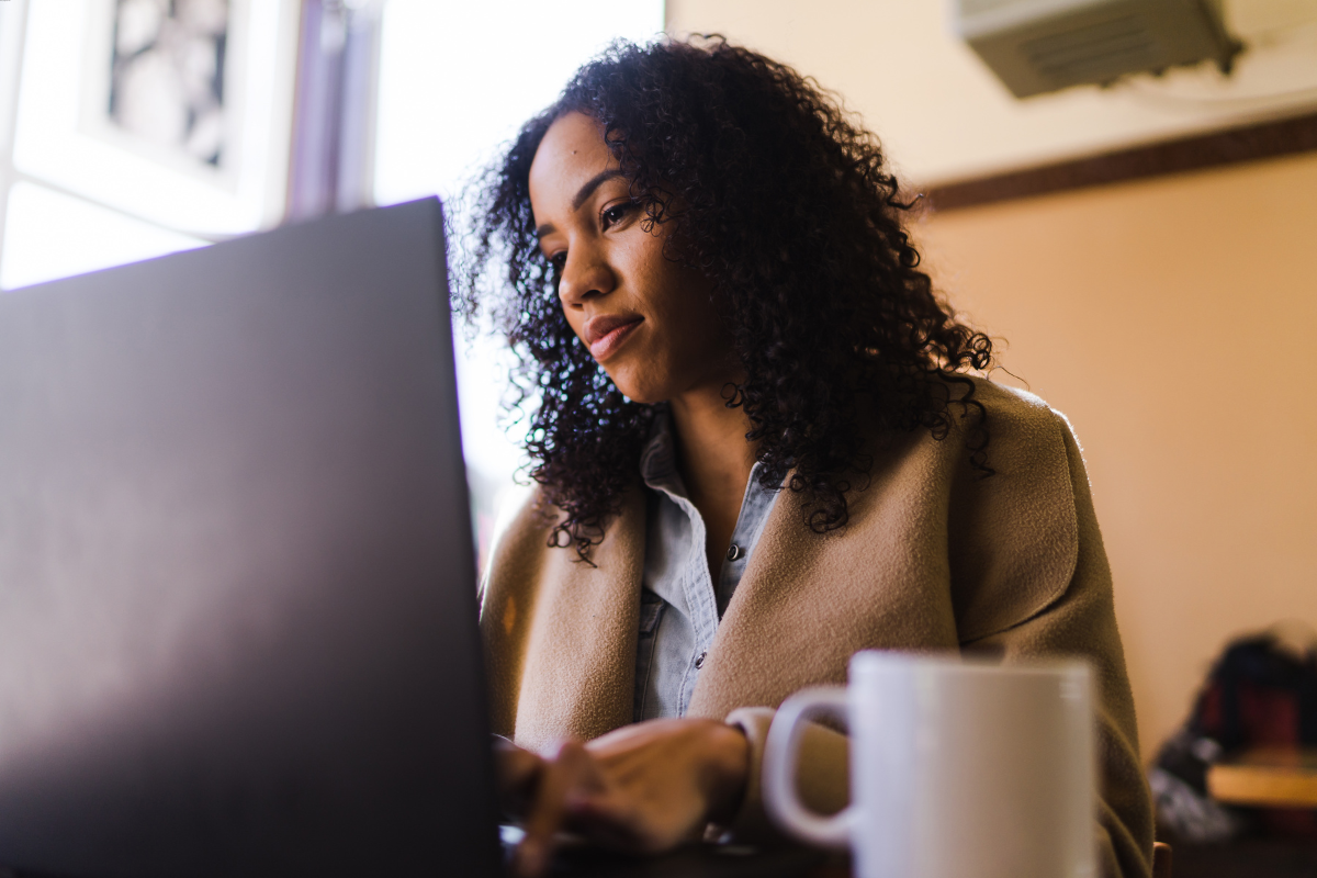A woman using a computer.