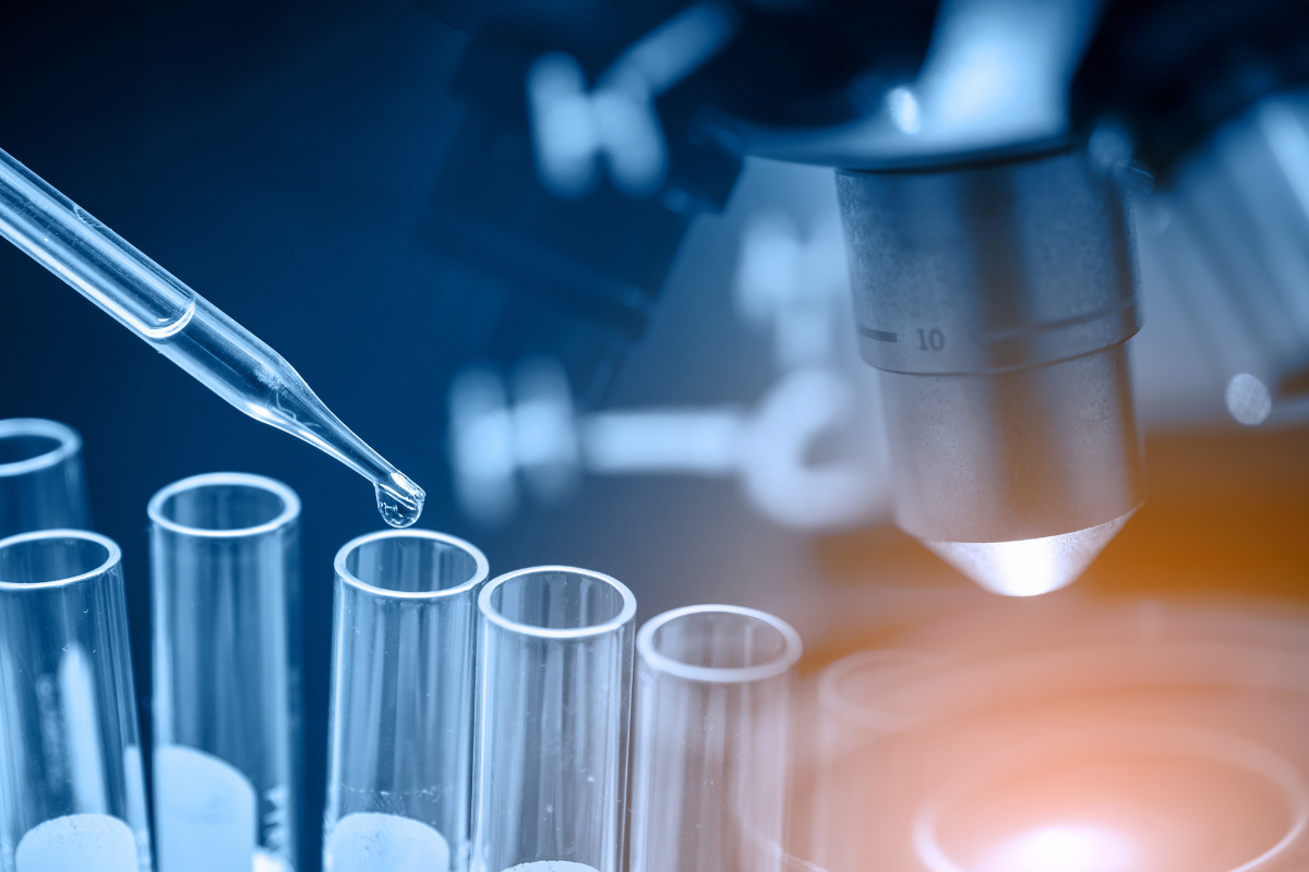 A microscope and test tubes in a wet lab