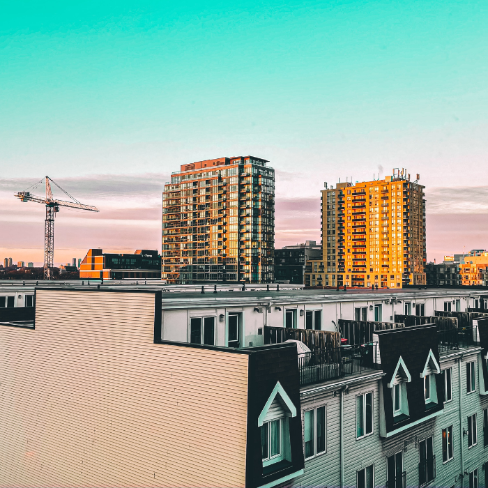 Suburban Toronto. A crane is visible on the horizon next to multi-res buildings and highrises.