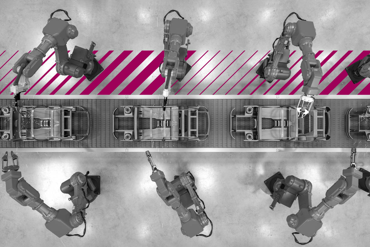 Two mechanical arms manufacturing on an assembly line.