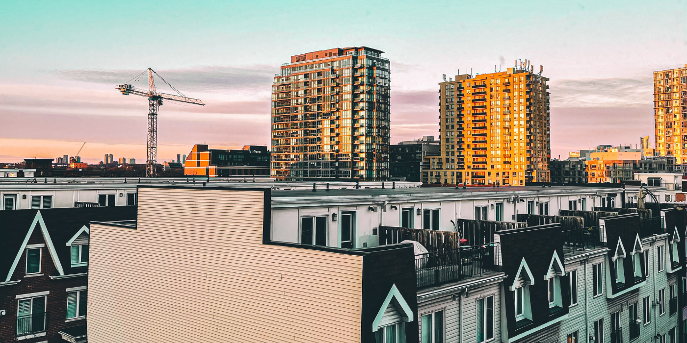 Suburban Toronto. A crane is visible on the horizon next to multi-res buildings and highrises.