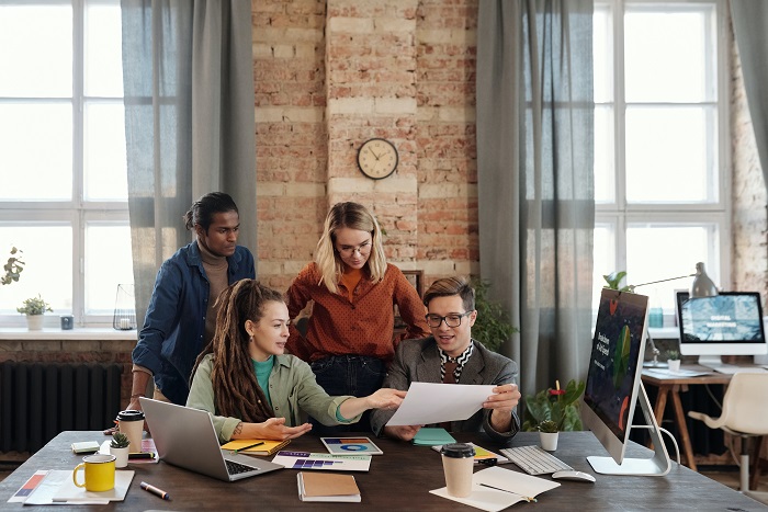 A group of people working at a table.