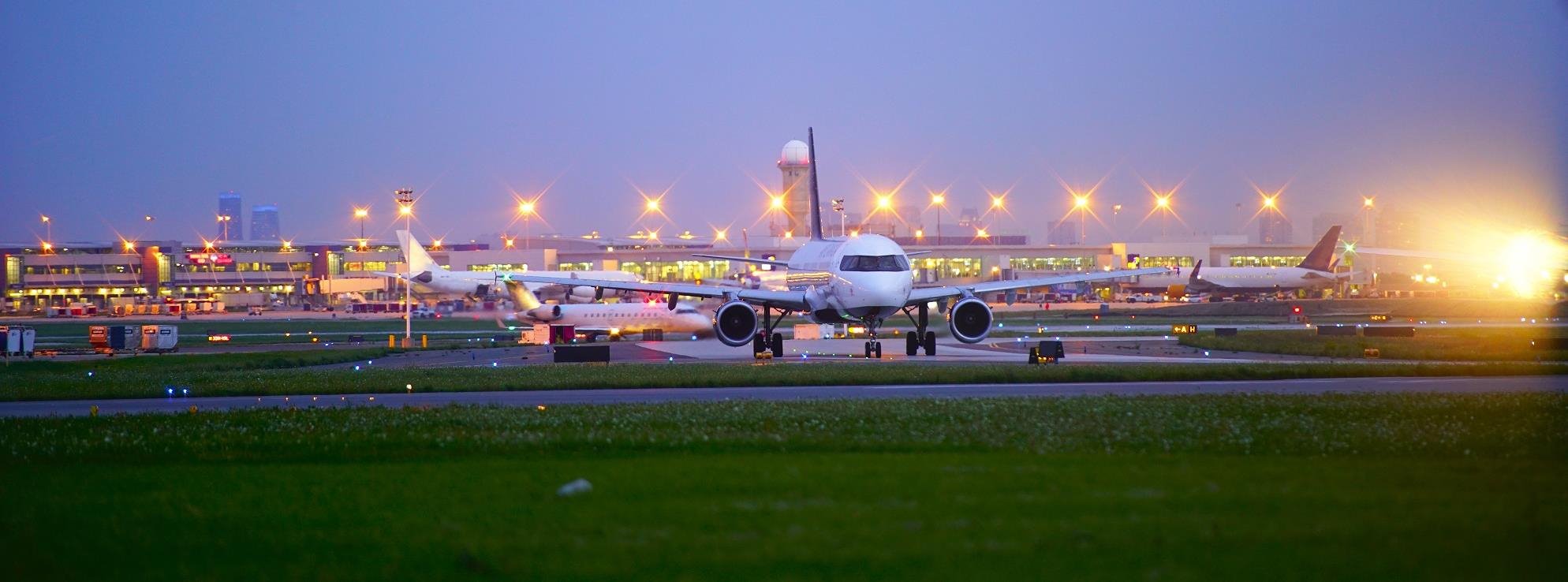 A series of planes taxing the runway.