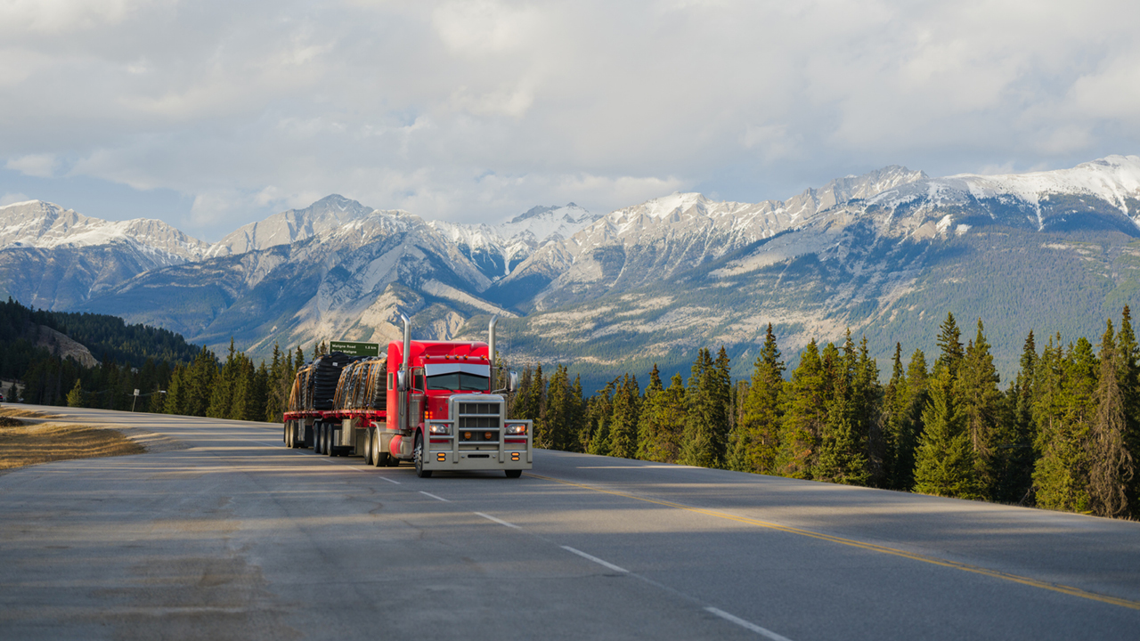 Truck in front of mountain