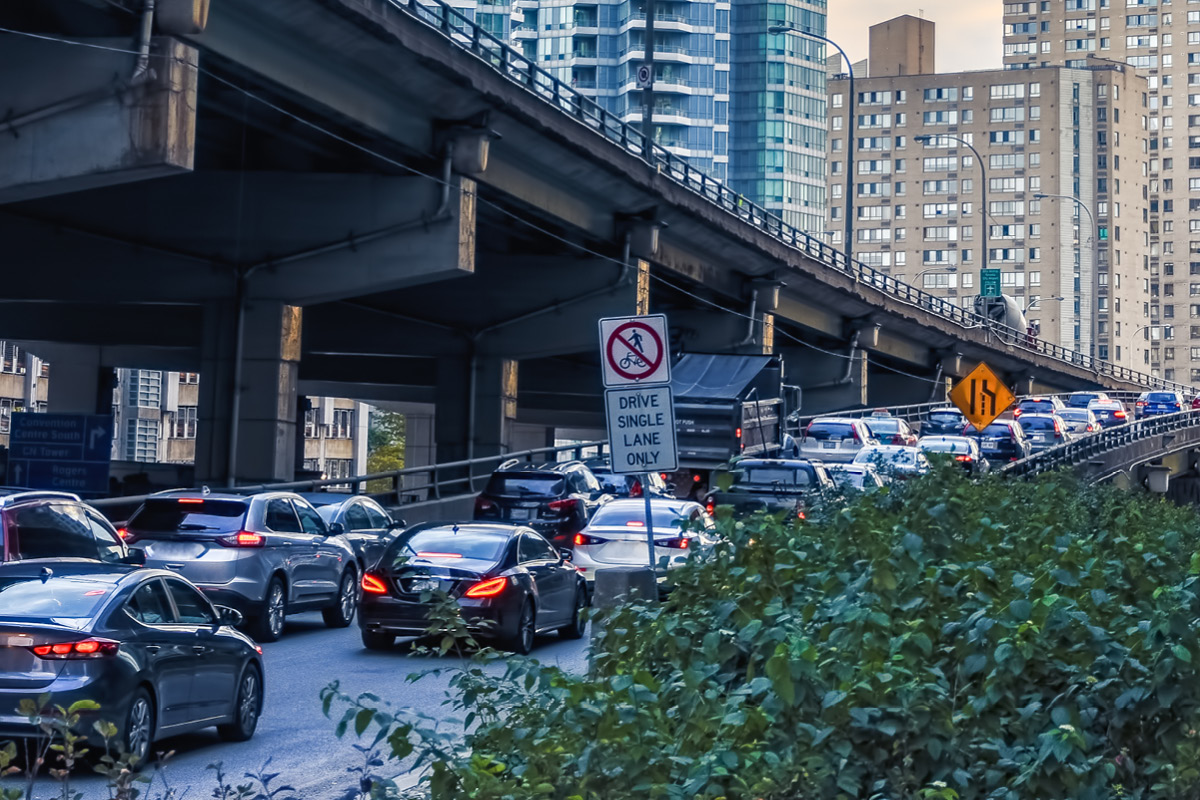 A line of cars waiting to merger onto the Gardiner Expressway in Toronto