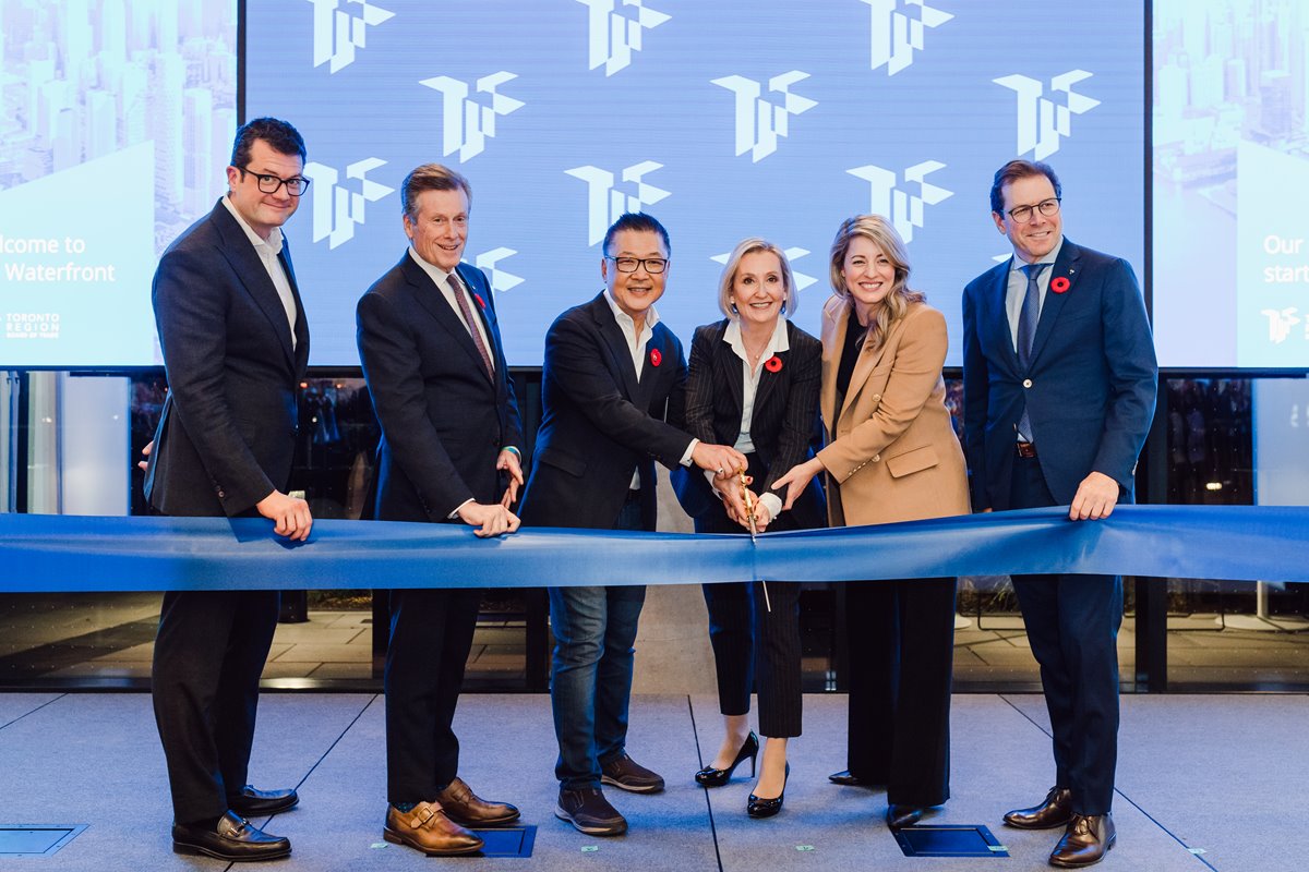 Officials cut the ribbon on the new TRBOT event space at 100 QQ East.